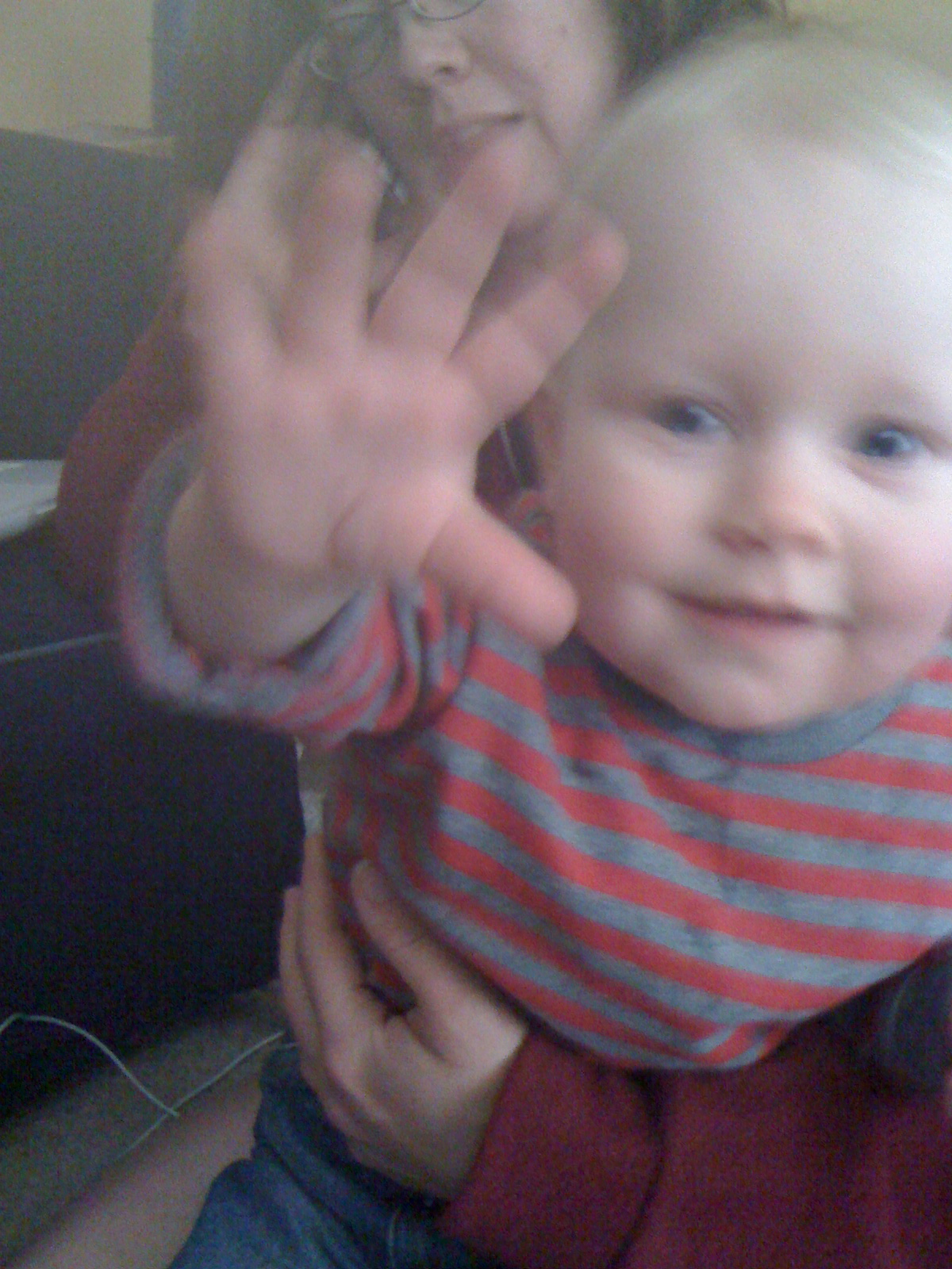Baby E waving, eleven months old