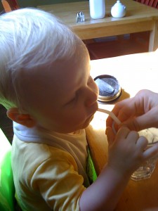 Baby E drinking from a straw
